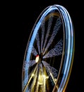 Defocused Ferris Wheel at amusement park at night. Blur abstract spinning wheel background Royalty Free Stock Photo