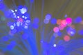 Defocused fiber optic lights with blue and pink bokeh. Royalty Free Stock Photo