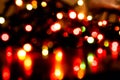 Defocused glowing shiny colorful christmas sparkles with reflections on dark Royalty Free Stock Photo