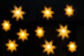 Defocused golden bokeh in a shape of a star Royalty Free Stock Photo