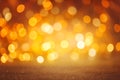 Defocused golden Christmas bokeh background. Sparkle abstract shiny festive texture