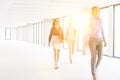 Defocused image of businesswomen walking in empty new office