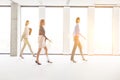 Defocused image of businesswomen walking in empty workspace