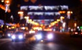 Defocused image, night city street. Blurred lights and houses. Royalty Free Stock Photo