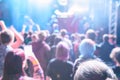 Defocused image of people crowd at concert and stage lights Royalty Free Stock Photo