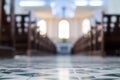 Defocused interior of Catholic church with pews Royalty Free Stock Photo