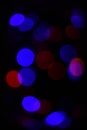 Defocused light of colorful garland. Abstract colorful bokeh background. Festive backdrop with colorful lights. Bright Royalty Free Stock Photo