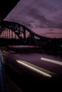 Defocused Lights of cars at night in Krakow bridge. Street line lights. Night highway city. Long exposure photograph Royalty Free Stock Photo