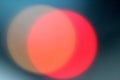 Defocused lights, red lens flare. Abstract blured background