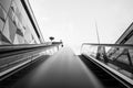 Black and white tone, interior view of stairway over handrail of escalator from underground metro station. Royalty Free Stock Photo