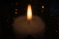 Candle burns at dusk, a candle fire on a black background Royalty Free Stock Photo