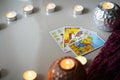 Defocused mystic ritual with tarot cards, and candles.