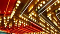 Defocused old fasioned electric lamps glowing at night. Abstract close up of blurred retro casino decoration shimmering, Las Vegas Royalty Free Stock Photo