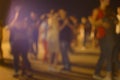 Defocused people dancing on apen-air party Royalty Free Stock Photo