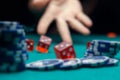 Defocused photo of dice, chips, palm in casino Royalty Free Stock Photo