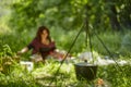 Defocused picnic background. Blurred background woman and bowler hat on fire in summer forest.Picnic Royalty Free Stock Photo