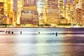 Defocused picture of Manhattan waterfront at night, abstract urban background, New York City, USA Royalty Free Stock Photo