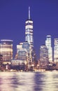 Defocused picture of New York City night skyline, abstract urban background, color toning applied, USA Royalty Free Stock Photo