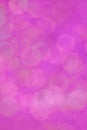 Defocused purple background with abstract bokeh bubbles for cell phone wallpaper or celebration and holiday card