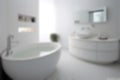 Defocused Round Bathroom Table With White Mosaic Tiles On The Wall Modern White Minimalist Design. Generative AI