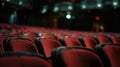 Defocused rows of empty seats create a sense of anticipation for the upcoming show as the dimly lit stage remains silent