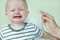 Defocused sad baby. Cry little child. Brush your teeth. Copy space - concept of pediatric oral hygiene, caries treatment