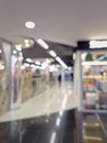 Defocused shopping mall interior. Blurred background of commercial center indoors view Royalty Free Stock Photo