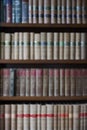 Defocused Shot Of Legal Books On Shelf In Office Of Lawyer Soliciitor Or Attorney