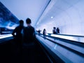 Defocused silhouettes of people inside Parisian underground metro moving