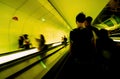 Defocused silhouettes of people inside Parisian underground metro moving