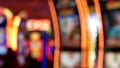 Defocused slot machines glow in casino on fabulous Las Vegas Strip, USA. Blurred gambling jackpot slots in hotel near Fremont