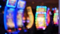 Defocused slot machines glow in casino on fabulous Las Vegas Strip, USA. Blurred gambling jackpot slots in hotel near Fremont