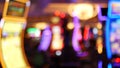 Defocused slot machines glow in casino on fabulous Las Vegas Strip, USA. Blurred gambling jackpot slots in hotel near Fremont