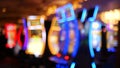 Defocused slot machines glow in casino on fabulous Las Vegas Strip, USA. Blurred gambling jackpot slots in hotel near Fremont Royalty Free Stock Photo