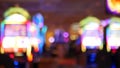Defocused slot machines glow in casino on fabulous Las Vegas Strip, USA. Blurred gambling jackpot slots in hotel near Fremont