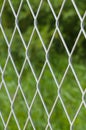 Defocused solid metallic mesh fence