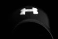 Defocused Under Armour logo on black hat