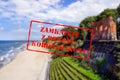 Defocused view of beach and ruins in Trzesacz. Empty, closed due to covid19 with Polish notice Closed due to Coronavirus