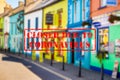 Defocused view of exterior of colourful small shops or restaurants, empty and closed due to coronavirus Royalty Free Stock Photo