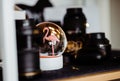 Defocused view of a glass bowl with pink flamingo inside