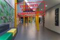 Defocused view of interior of college, empty and closed due to covid 19 with Polish notice Closed due to Coronavirus