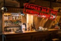 Defocused view of interior of traditional bar or restaurant, empty and closed due to coronavirus