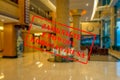 Defocused view of interior of an upmarket hotel reception, empty and closed with Polish notice Closed due to Coronavirus Royalty Free Stock Photo