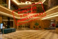 Defocused view of interior of an upmarket hotel reception, empty and closed with Polish notice Closed due to Coronavirus Royalty Free Stock Photo