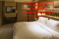Defocused view of interior of an upmarket hotel room, empty and closed with Polish notice Closed due to Coronavirus Royalty Free Stock Photo