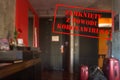 Defocused view of interior of an upmarket hotel room, empty and closed with Polish notice Closed due to Coronavirus Royalty Free Stock Photo