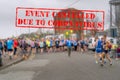 Defocused view of sport contestants for marathon race. Sports event cancelled due to coronavirus