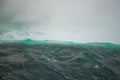 Defocused water background - whirlpool waves, blue tint. Abstract background with liquid fluid texture. Niagara river Royalty Free Stock Photo