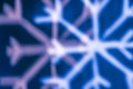 White snowflake bokeh on blue background â winter holiday abstract background, front view Royalty Free Stock Photo