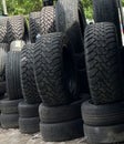 Defocusing Foto and zoom in. Stacked used auto tires in the car service center, in the morning